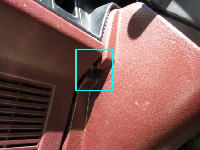 Screw located on steering column, left