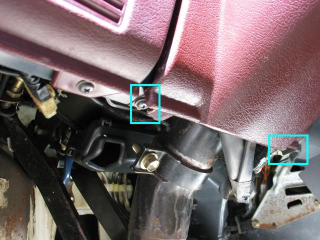 Screws located on steering column, bottom