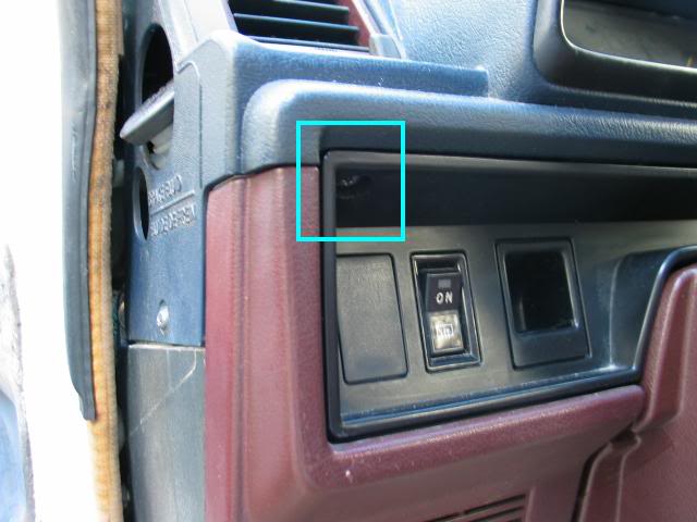 Screw located above rear wiper switch